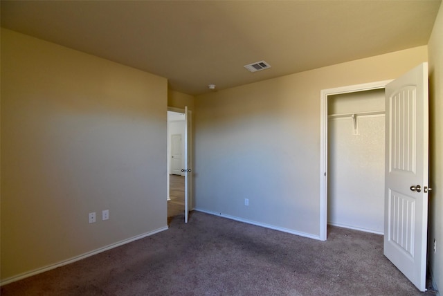 unfurnished bedroom featuring carpet floors, baseboards, and visible vents