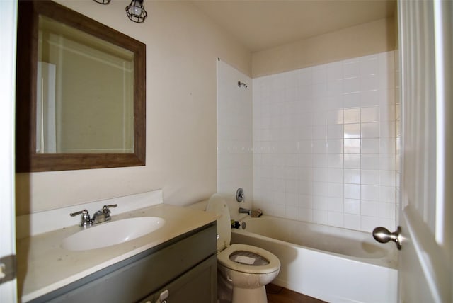 bathroom with shower / washtub combination, vanity, and toilet