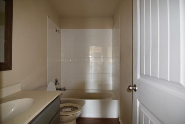 bathroom with toilet, shower / washtub combination, and vanity