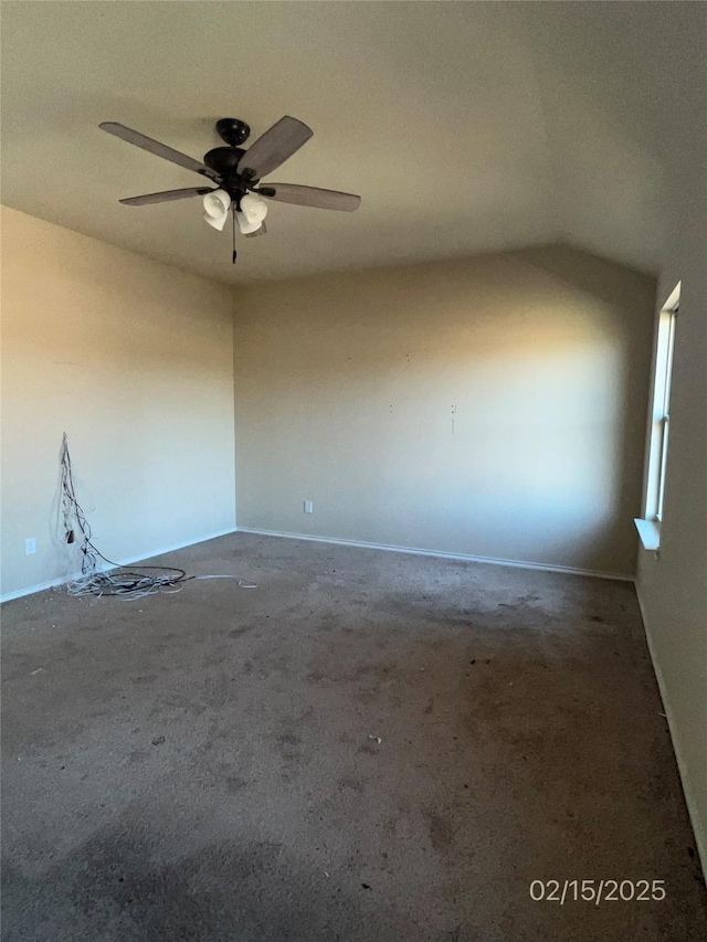 unfurnished room featuring a ceiling fan and vaulted ceiling