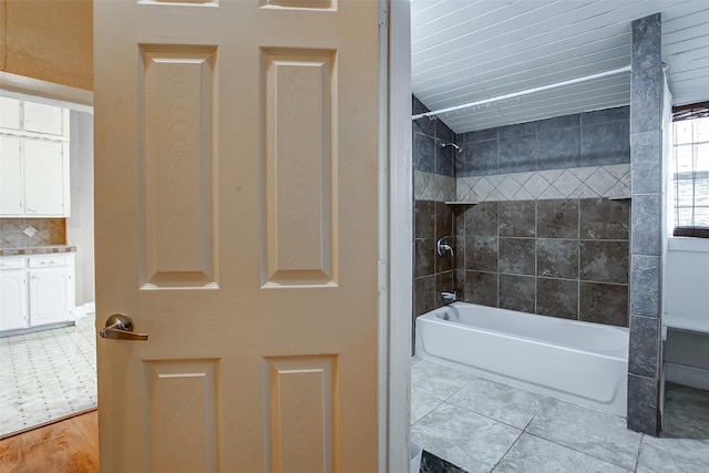 bathroom with bathing tub / shower combination and tile patterned floors