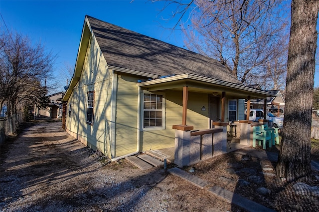 exterior space with a shingled roof