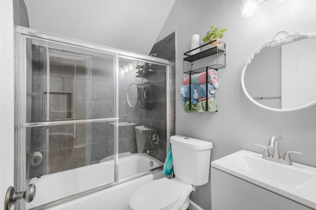 full bathroom with lofted ceiling, bath / shower combo with glass door, vanity, and toilet