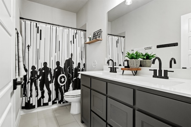 full bathroom featuring tile patterned flooring, a sink, toilet, and double vanity