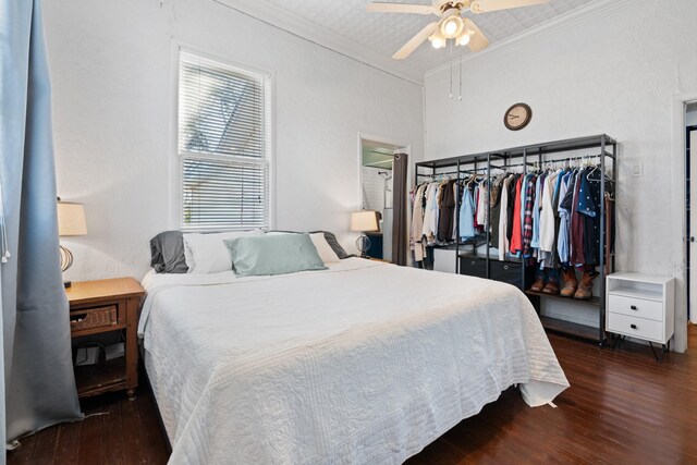 bedroom with ornamental molding, ceiling fan, and wood finished floors