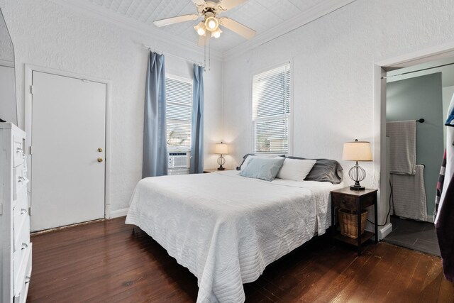 bedroom with hardwood / wood-style flooring, ornamental molding, and cooling unit