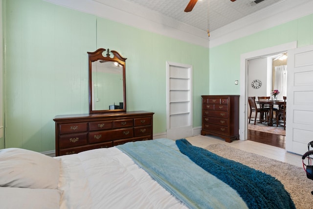 bedroom with ceiling fan and wood finished floors