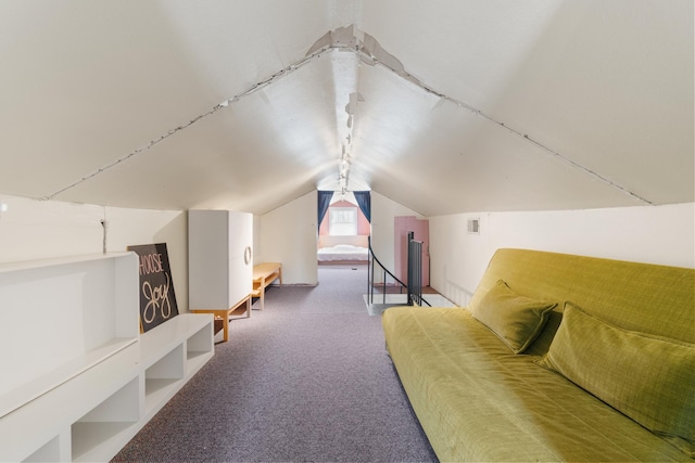 additional living space featuring vaulted ceiling, carpet floors, and visible vents