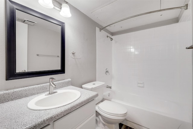 bathroom featuring toilet, tub / shower combination, and vanity