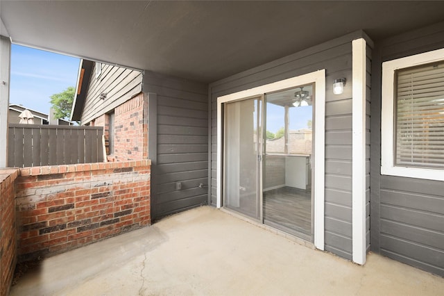 view of patio featuring fence