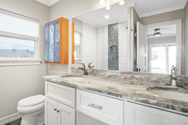 full bathroom with double vanity, ornamental molding, a sink, and toilet