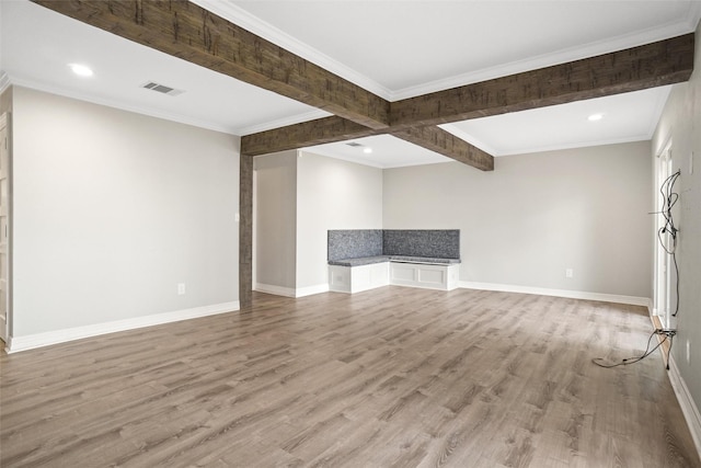 unfurnished living room with baseboards, visible vents, crown molding, light wood-style floors, and recessed lighting