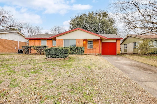 ranch-style house with brick siding, a front yard, and central air condition unit