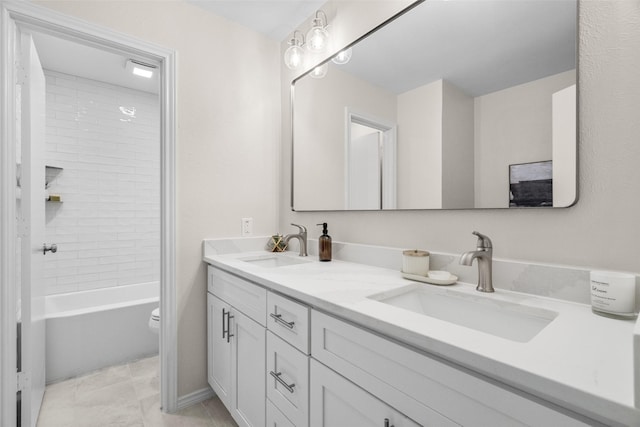 bathroom with shower / bathtub combination, double vanity, a sink, and toilet