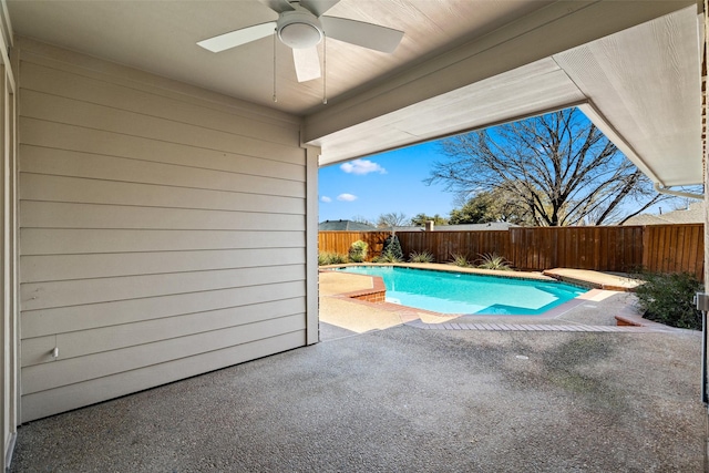 view of swimming pool featuring a fenced in pool, a fenced backyard, ceiling fan, and a patio