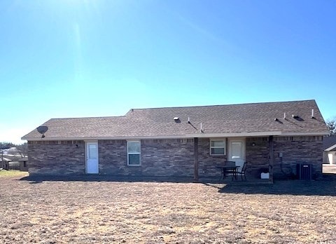 rear view of property with central air condition unit