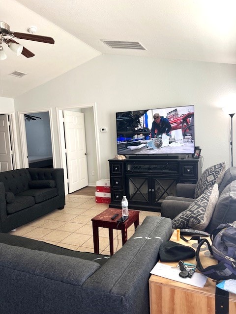 tiled living area featuring visible vents, vaulted ceiling, and a ceiling fan