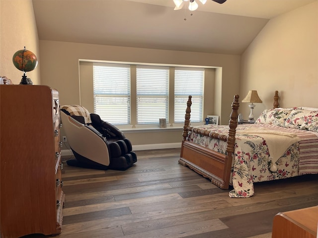 bedroom featuring lofted ceiling, ceiling fan, dark wood-type flooring, and baseboards