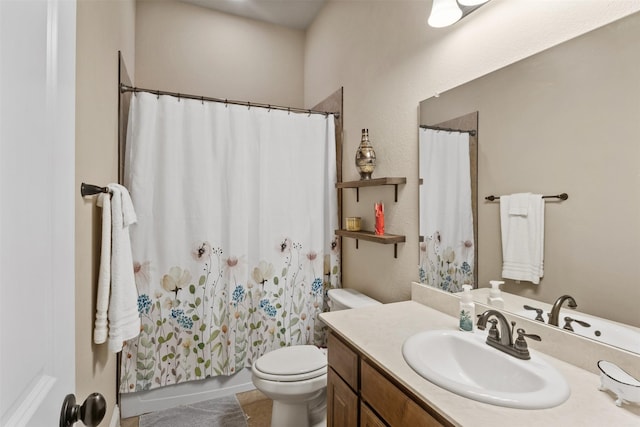 full bath with vanity, toilet, and tile patterned floors