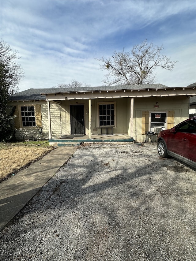 view of front of house featuring roof with shingles