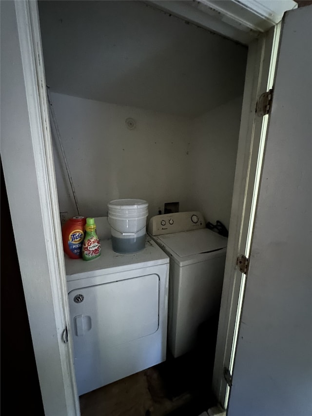 laundry room featuring washing machine and clothes dryer