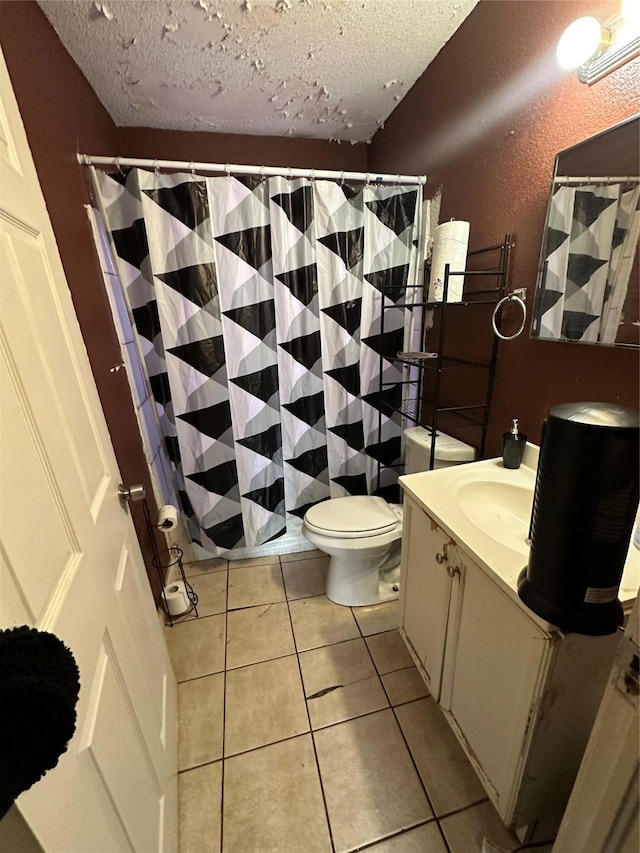 full bath with toilet, a textured ceiling, vanity, and tile patterned floors