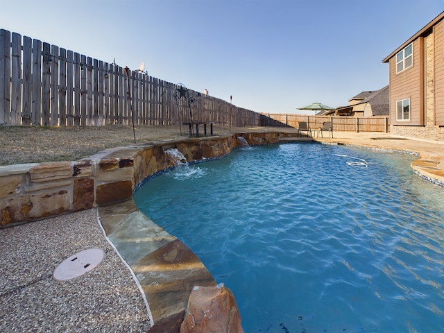 view of pool with a fenced backyard, a fenced in pool, and a patio