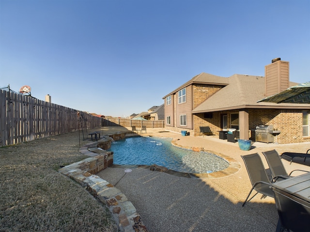 view of swimming pool featuring a fenced in pool, a fenced backyard, a grill, and a patio