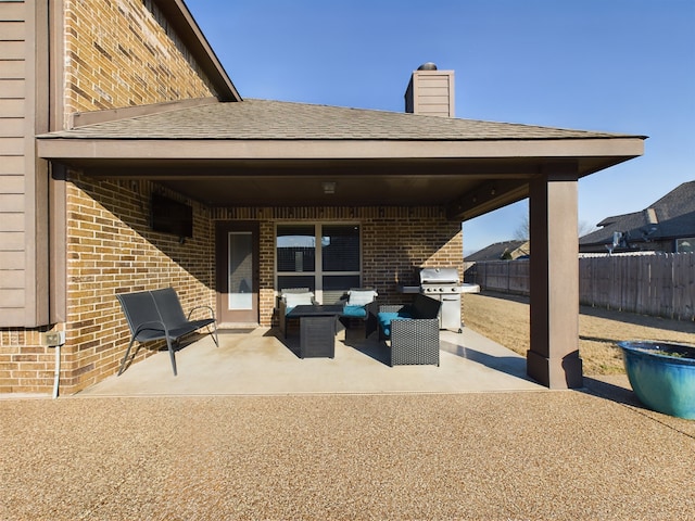 view of patio / terrace featuring fence, grilling area, and an outdoor living space