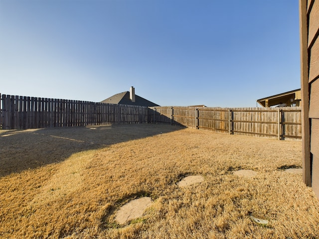 view of yard featuring a fenced backyard