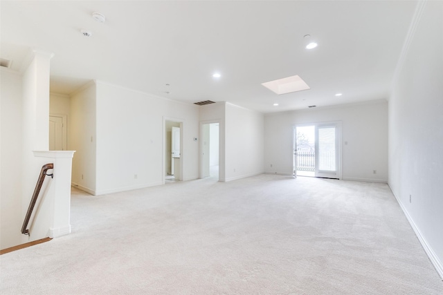 unfurnished living room featuring light carpet, baseboards, visible vents, and ornamental molding