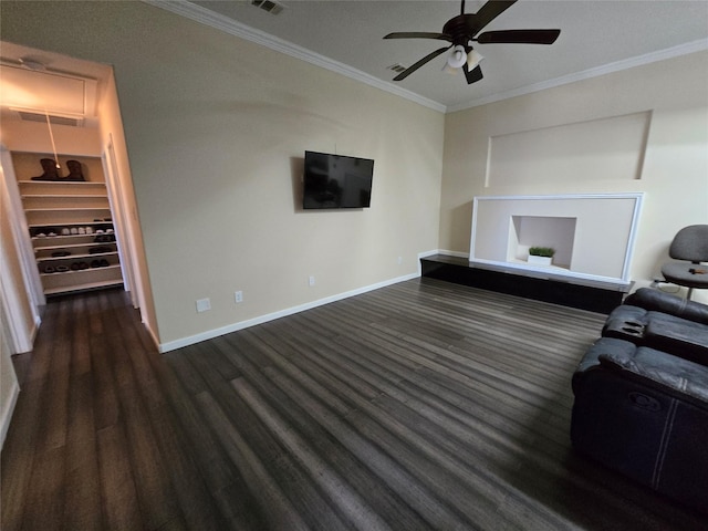 living room with baseboards, attic access, visible vents, and crown molding