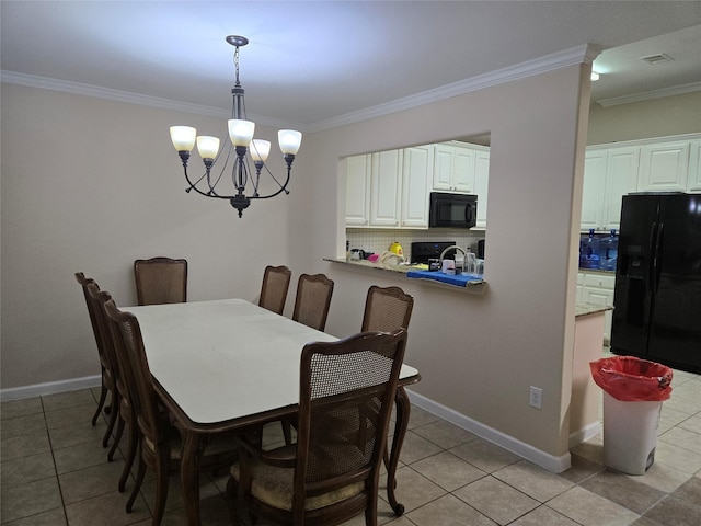 dining room featuring baseboards, ornamental molding, and a notable chandelier