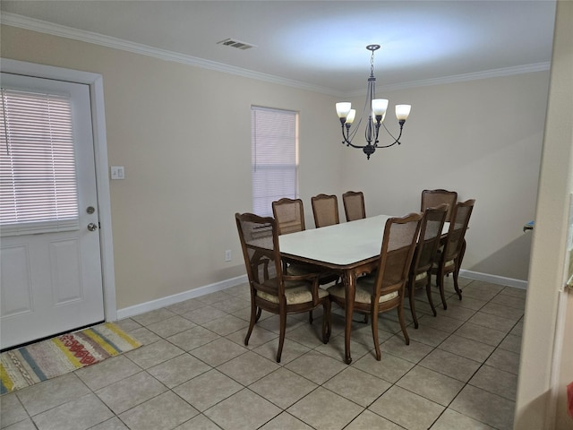 dining space with ornamental molding, visible vents, and plenty of natural light