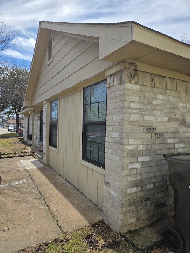 view of property exterior with a patio