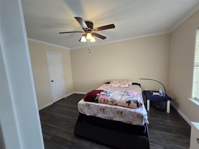 bedroom featuring baseboards, dark wood finished floors, a ceiling fan, and crown molding