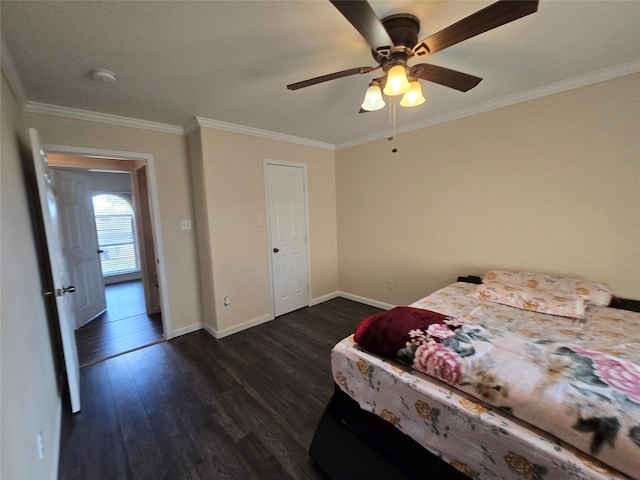 bedroom with dark wood-style floors, ceiling fan, baseboards, and crown molding