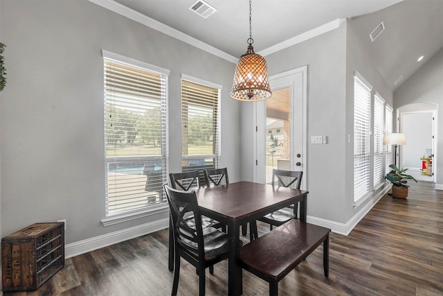 dining area with baseboards, visible vents, and dark wood finished floors