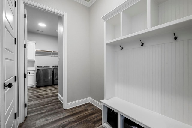 mudroom with washing machine and dryer, visible vents, dark wood finished floors, and baseboards