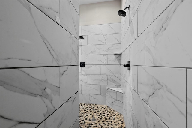 bathroom featuring a tile shower