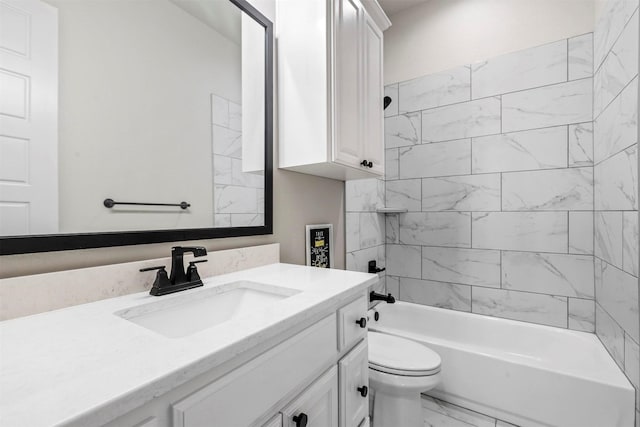 bathroom featuring toilet, marble finish floor, shower / tub combination, and vanity