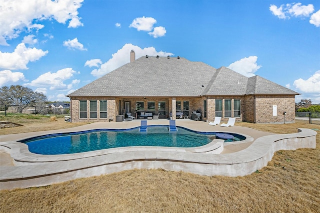 view of swimming pool featuring a patio, outdoor lounge area, fence, and a fenced in pool