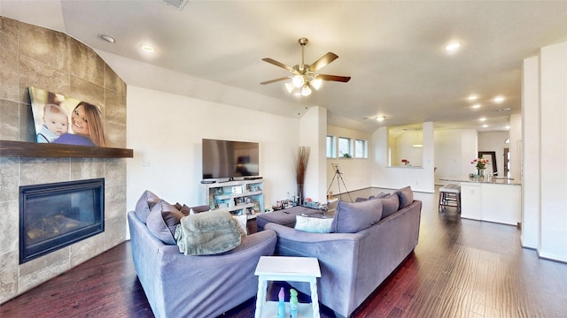 living room with a fireplace, dark wood finished floors, a ceiling fan, and recessed lighting