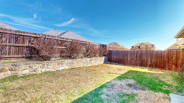 view of yard with a fenced backyard