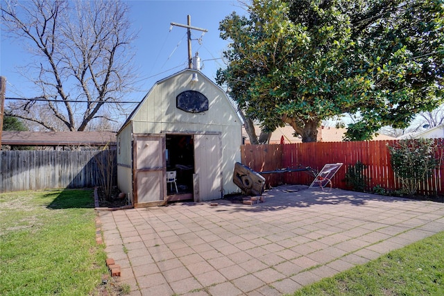 view of shed with a fenced backyard