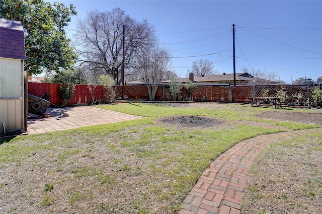 view of yard with a fenced backyard and a patio