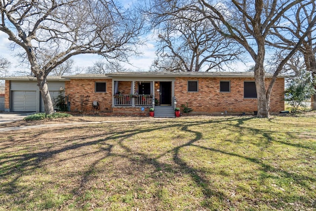 ranch-style home featuring an attached garage, a front lawn, a porch, and brick siding