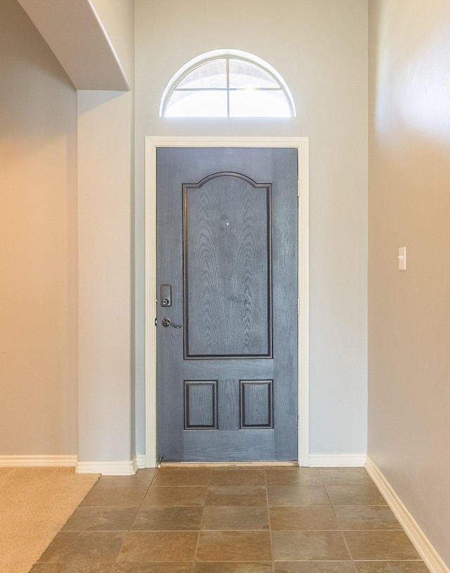 entryway featuring baseboards