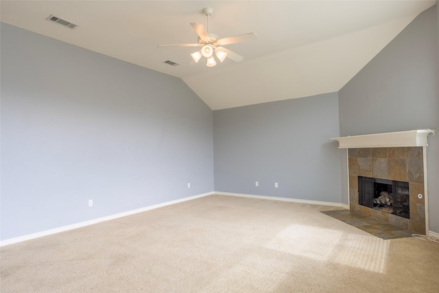 unfurnished living room with ceiling fan, a fireplace, visible vents, and vaulted ceiling