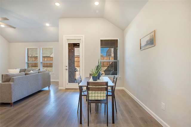 dining area with lofted ceiling, recessed lighting, wood finished floors, and baseboards